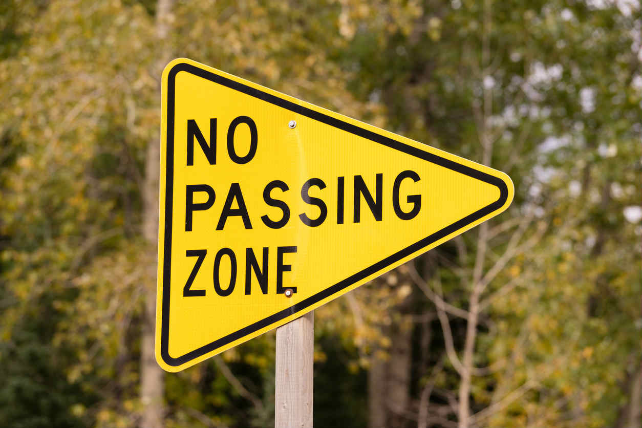 equilateral triangle in no passing zone sign