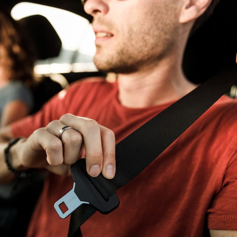 st. louis driver putting on their seat belt