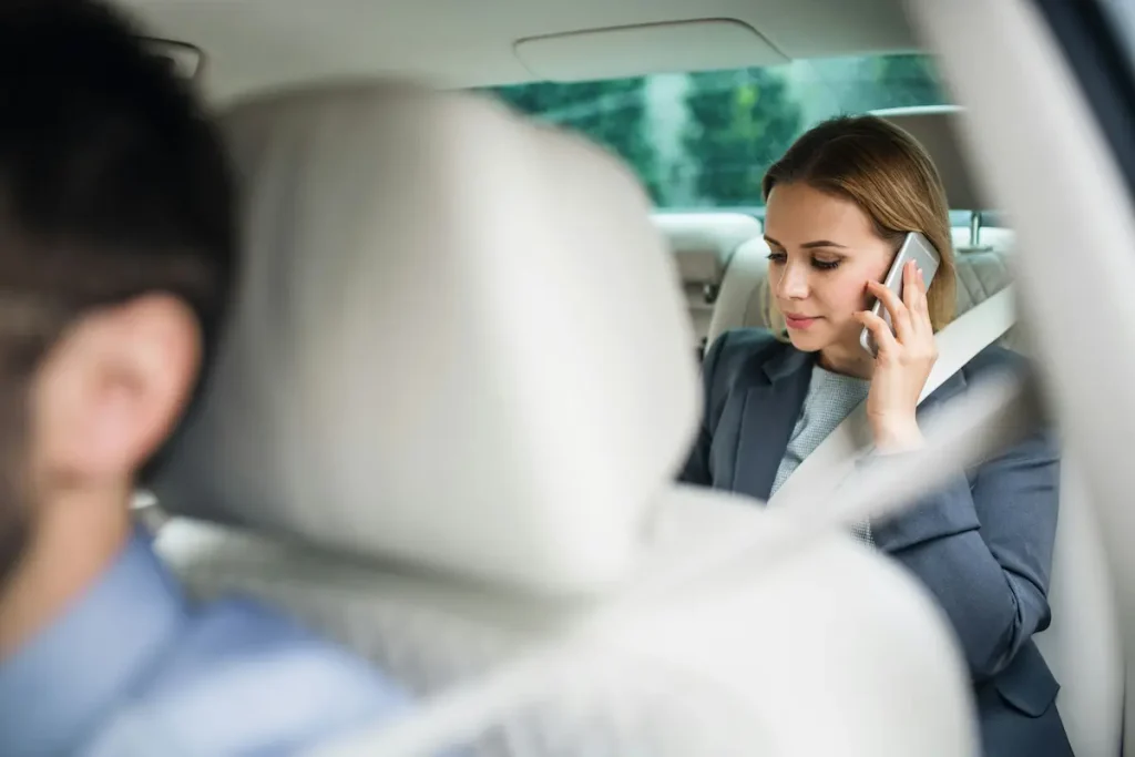 st. louis business woman on the phone in the back of an Uber